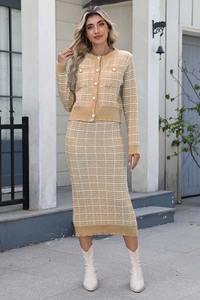 Detailed texture of yellow and white plaid knit cardigan with pearl buttons and skirt