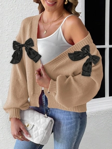 Women's khaki knit cardigan with black bow accents and long sleeves in casual style