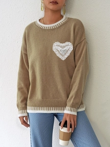 Loose khaki knit sweater featuring lace heart patch and contrasting striped ribbed trim