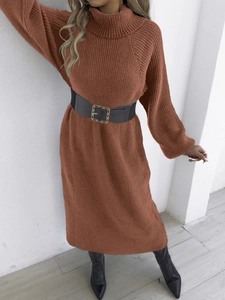 Detail of caramel knit sweater dress with high collar and ribbed texture fabric