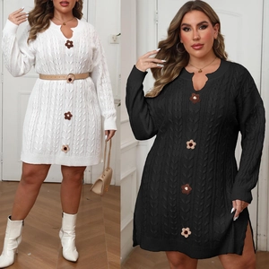Detail of cable knit plus size dress with hand-crocheted flowers and V-neckline
