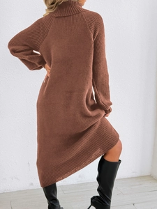 Detail of high neck long sleeve knit dress in caramel brown with vertical ribbed texture