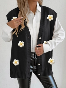 Women's black knit cardigan vest with 3D floral patches and elegant pearl buttons
