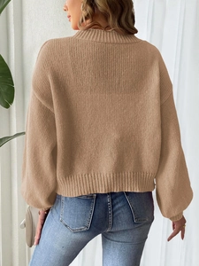 Back view of a camel knitted cardigan with ribbed texture and loose fit for autumn
