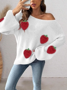 Detail of chunky knit white sweater with 3D handmade red crochet strawberry patches