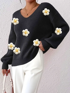 Women's black V-neck knit sweater with 3D white floral appliques and long sleeves