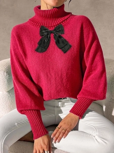 Women's rose red high neck knit sweater with large black satin bow and long sleeves