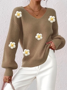 Women's V-neck tan knit sweater featuring 3D white crochet flower appliques and lantern sleeves
