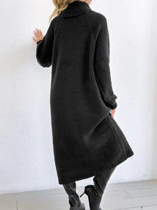 Back view of a black high neck knitted maxi dress with vertical texture for autumn winter