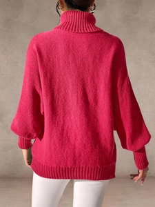 Rear view of rose red oversized knit sweater featuring turtleneck and lantern sleeves