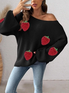 Close-up of 3D knitted strawberry patches on a black off-shoulder sweater for women