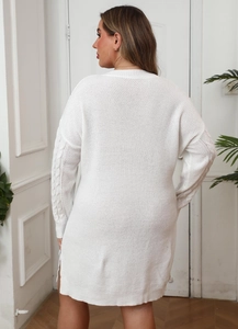 Detailed back view of white cable knit midi dress with side slit and thick texture