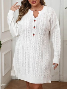 Detail of white cable knit dress featuring strawberry buttons and V-neckline texture