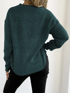 Deep teal long sleeve knit sweater with round neck and curved hem in a back view