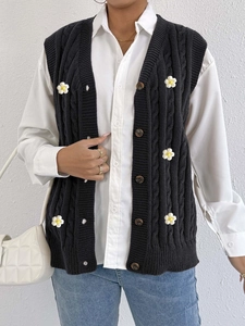 Women's black cable knit cardigan vest featuring 3D white daisy floral appliques and V-neck