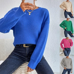 Detail view of round neck knit sweaters in blue beige green pink and grey colors