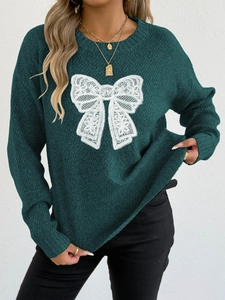 Dark green knit sweater featuring a central white lace butterfly design and round neck