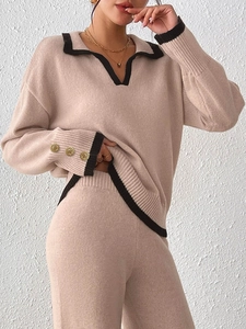 Elegant beige knit two-piece set for women featuring contrast trim and gold buttons