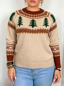 Close-up of festive knit sweater detail featuring green Christmas tree and brown wave patterns