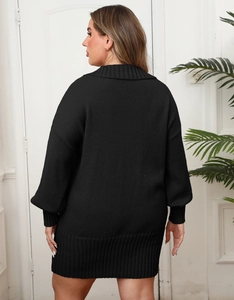 Detail view of black rib-knit polo dress with lantern sleeves and textured knit pattern