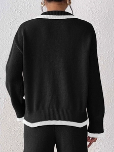 Women black knit sweater with white trim contrast collar and elegant gold buttons detail