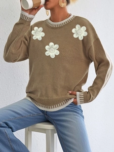 Relaxed brown knit sweater with 3D white floral appliques and striped ribbed trims