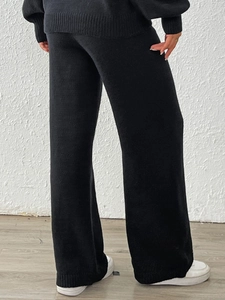 Women's chic black knitted two-piece set featuring wide leg pants and matching top