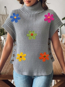 Gray turtleneck knit vest with large colorful 3D crochet flowers and side button detail