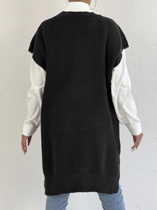 Back view of a sleeveless black knit vest midi dress with side slits and textured knit