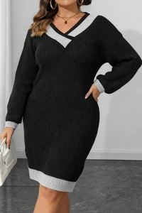 Detailed macro view of the contrast color ribbing on the V-neck knit dress