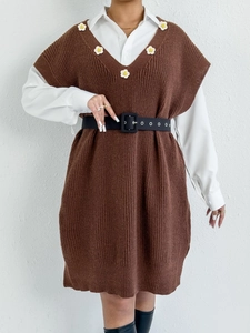 Detailed view of dark brown knitted vest dress featuring floral 3D patchwork on the V-neckline