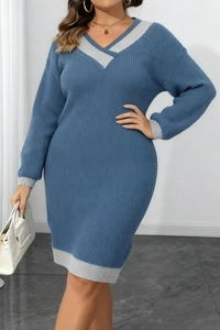 Close-up of blue and gray V-neck knitted dress featuring vertical ribbed texture and slim fit