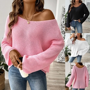 Detailed view of women's oversized off-shoulder knit sweater with flared sleeves and soft texture
