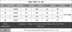 Size chart detail for striped knit sweater with chest and shoulder measurements