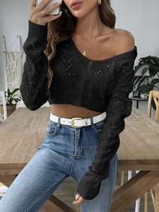 Women's black hollow knit crop top with deep V-neck and stylish long sleeves