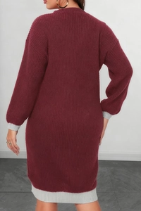 Detail of burgundy knit dress featuring grey contrast ribbed cuffs and hemline texture