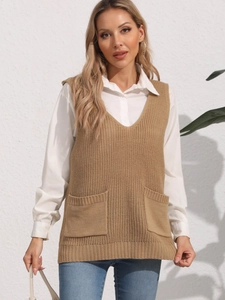 Detail of khaki V-neck knit vest featuring dual front pockets and ribbed hemline texture
