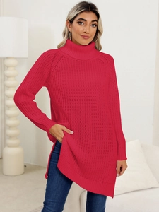 Detail view of high collar rose red knit sweater with side slits and textured patterns