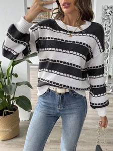 Detail showing the textured knit pattern on a black and white striped women's sweater