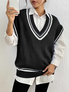 Detail of V-neck knitted vest with contrast stripes and soft ribbed texture finish