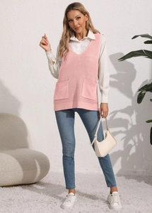 Detailed view of pink V-neck knit vest with front pockets and ribbed hem finish