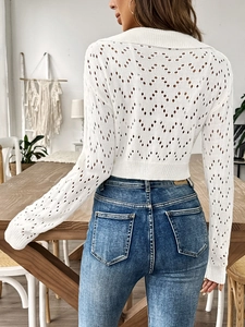 Detailed back view of a white hollow-out knit polo crop top featuring diamond patterns