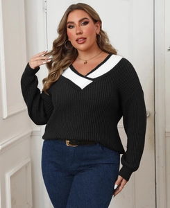 Detail of plus size sweater with contrast V-neckline and vertical ribbed knit texture