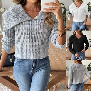 Macro view of textured rib knit collar and thick stitching details on women sweater