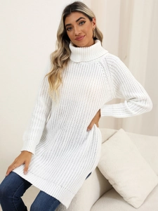 Close-up of white turtleneck knit sweater with ribbed cuffs and cozy texture