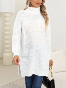 Detail of white chunky knit sweater with high neck and side slits on model