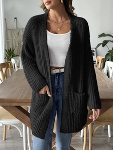 Women's black knit cardigan with textured loop yarn and large pockets for fall style
