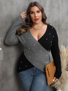 Detail view of V-neck sweater with pearl embellishments and contrast stitching color