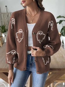 Detail of loose Halloween ghost cardigan with brown knit texture and white patterns