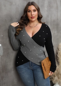 Detail of cross deep V-neck knit sweater featuring color block patchwork and pearl beads